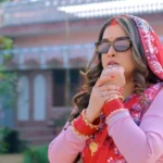 Amrapali Dubey in a saree as a detective daughter-in-law in CID Bahu trailer scene from Bhojpuri film.