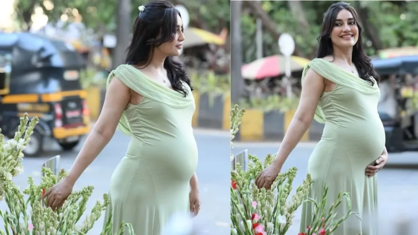Surbhi Jyoti ग्रीन बॉडीकॉन ड्रेस में बेबी बंप फ्लॉन्ट करते हुए फोटोशूट करवाती नजर आ रही हैं।