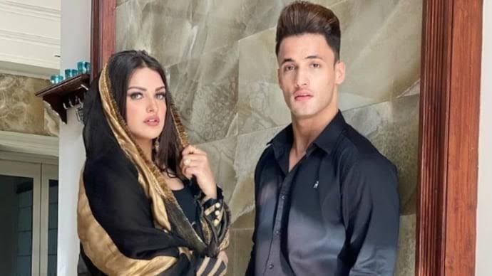 Asim Riaz and Himanshi Khurana posing together at an event, highlighting their past relationship amid recent news statements about religious differences.