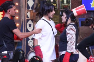 Reality show contestants during a fun challenge on stage